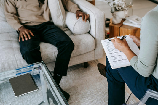 Therapist and patient sitting during a therapy session.