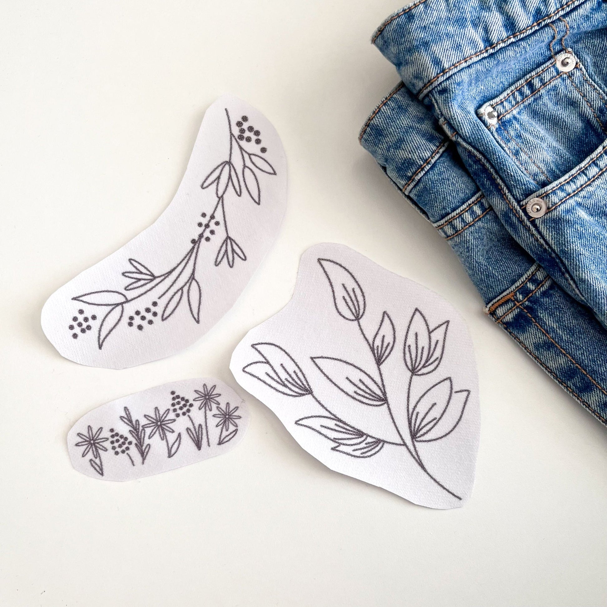Three Water Soluble Embroidery Transfers for Clothes. The designs contain leaves, flowers and blossom