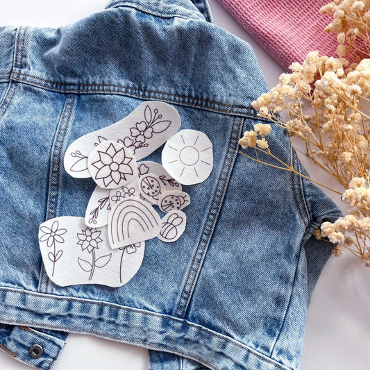 Embroidery patches pictured on top of jean  jacket