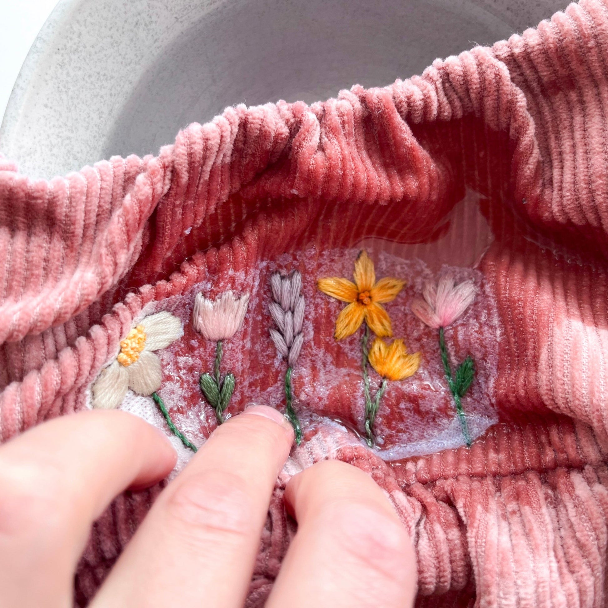 Fabric stabiliser being washed away in water