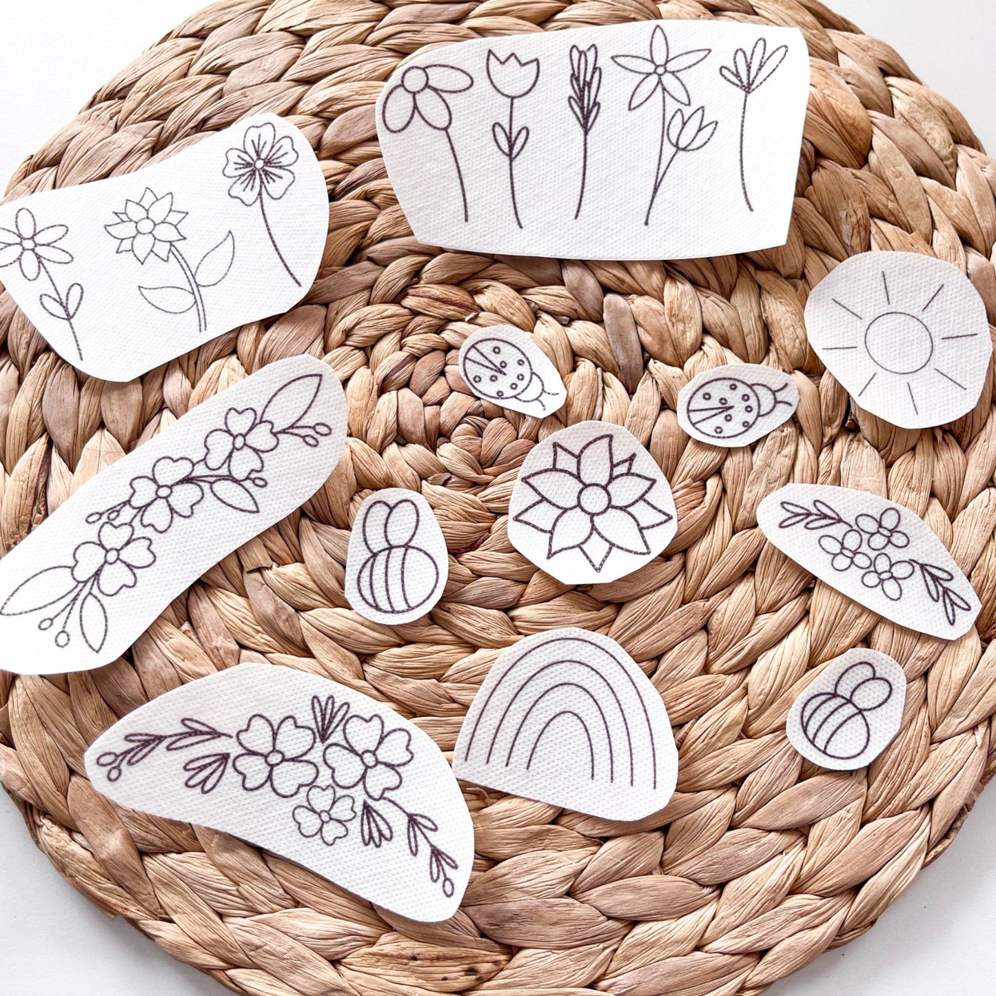 Designs in stick and Stitch packs include flowers, sun, rainbow, bees and ladybird.