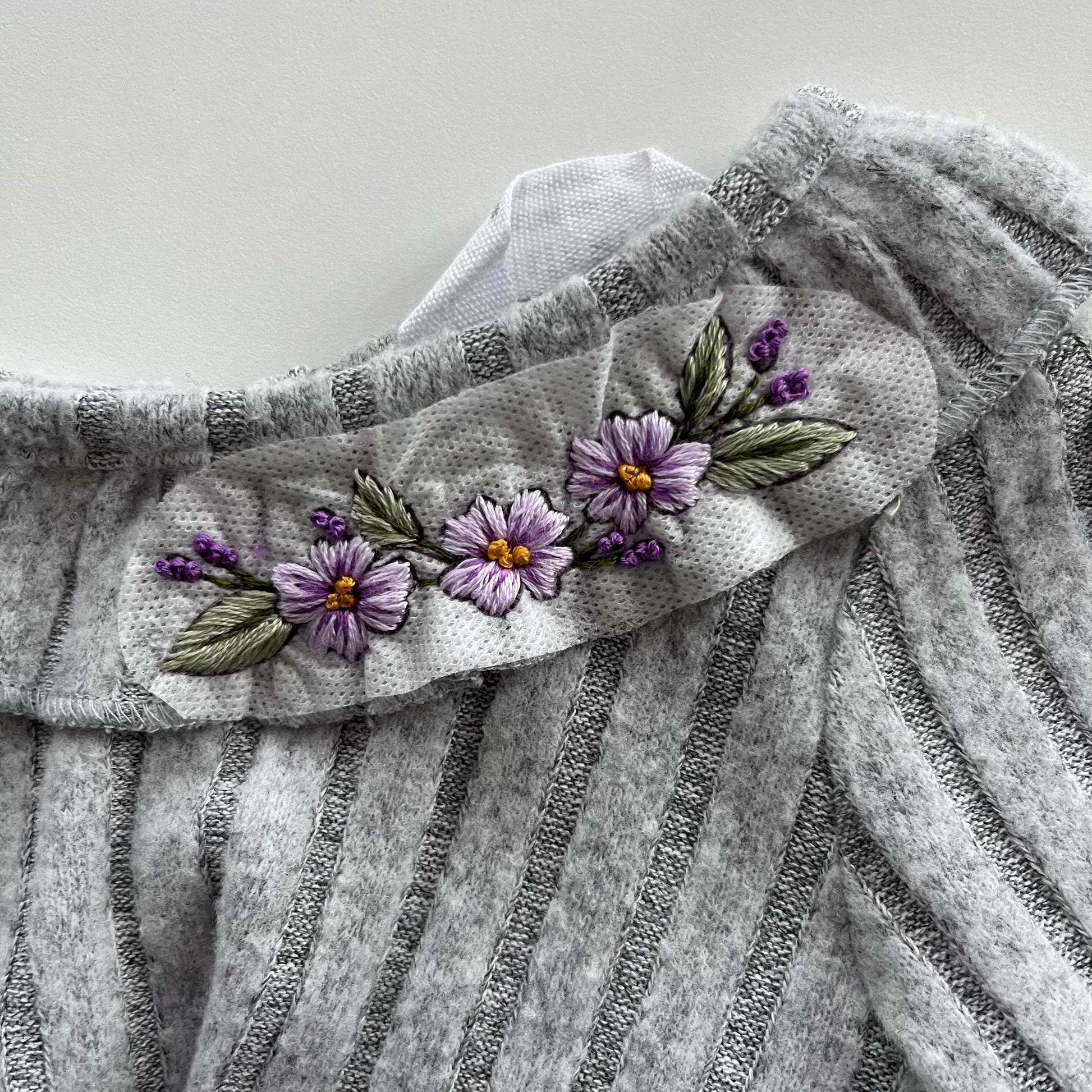 hand embroidered children's clothes in a floral design